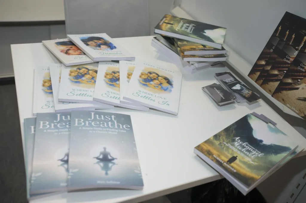 Books displayed on a table at a book fair