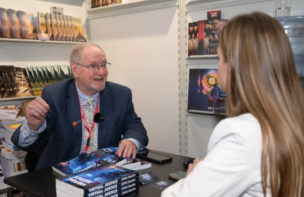 Author signing sci-fi books at a book fair